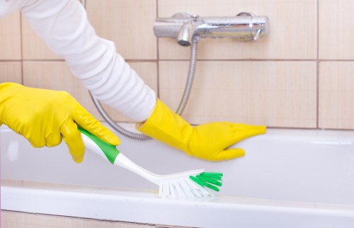 Professional cleaner preparing equipment before starting a scheduled job